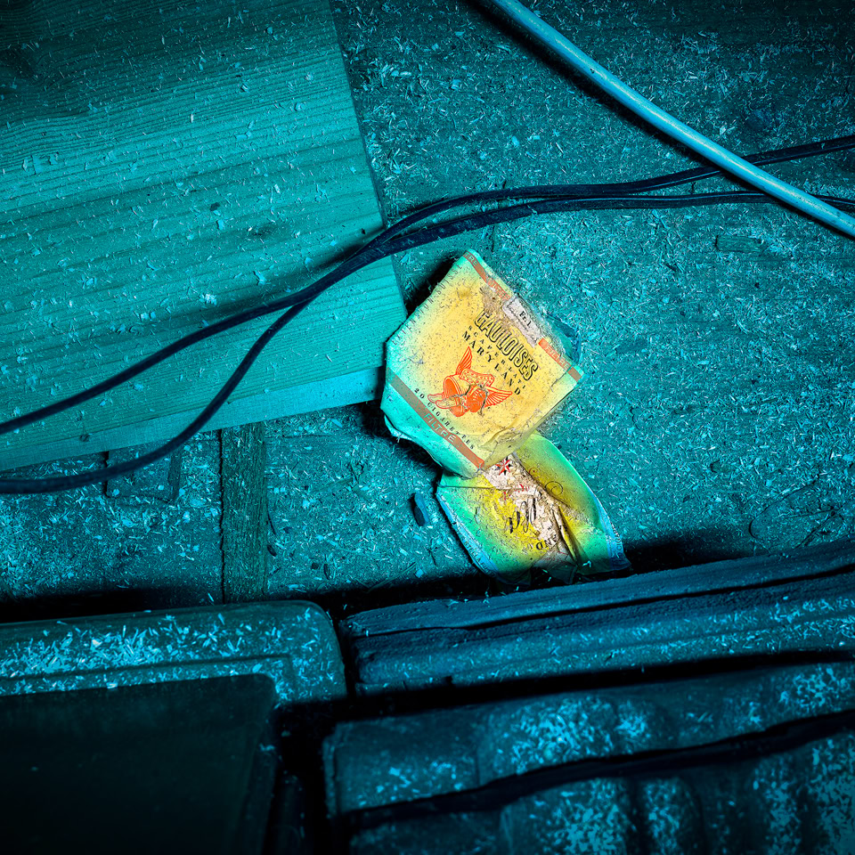 Old cigarette packets casually discarded on the ground